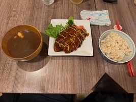 a bowl of soup, vegan pork chops and a bowl of rice