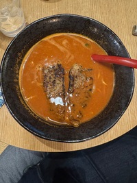 fermented tomato-based ramen with vegan pork chops