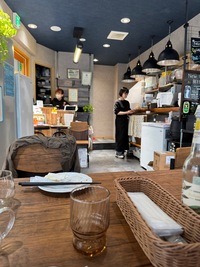 view of tiny restaurant, chef and servers abuzz