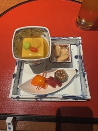 Kaiseki dinner: three appetiser on a square plate, each in their own little bowl, tofu, beans and jelly 