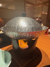 Kaiseki dinner: alumnium plate and lid cooking over a spiritus oven