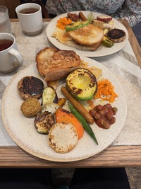 plate with assorted grilled veggies, avocado, sour dough bread