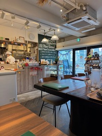 view of a small restaurant with half open kitchen