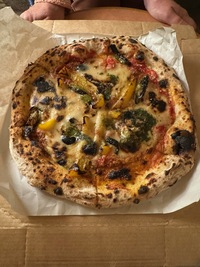 vegan pizza with thick crust, bell pepper slices and cheese